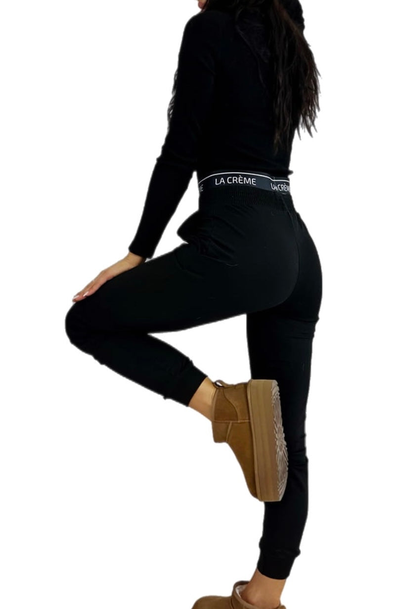 Top and sweatpants - 2 piece set. Woman's tracksuit. Colour:  black